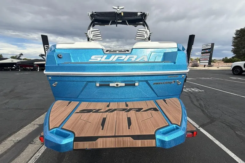 Slide: The Image of 2024 Supra SA 550 boat in vibrant blue, showcasing sleek design and advanced features. - 4