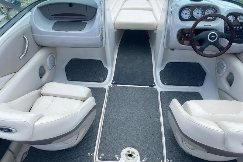 Slide: The Image of Interior of a 2005 Chaparral 210 SSi boat with plush seating and modern dashboard. - 3