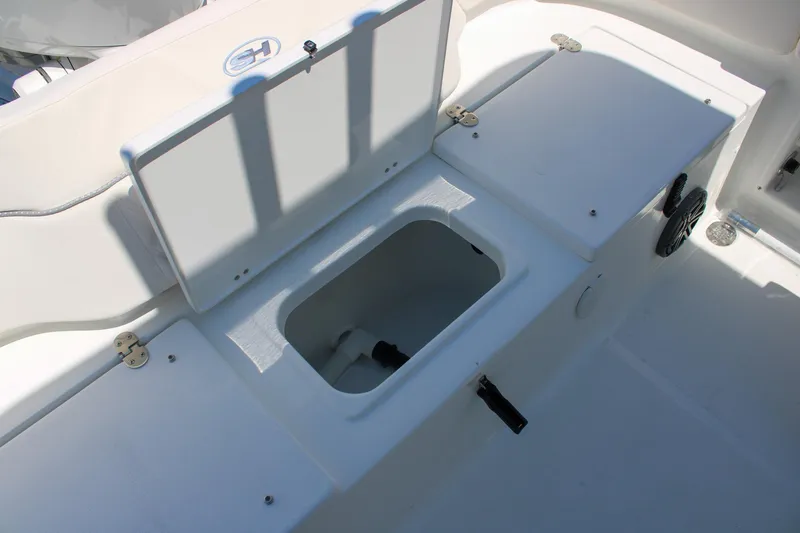 Slide: The Image of Open storage compartment on 2026 Sea Hunt Ultra 219 boat deck. - 17