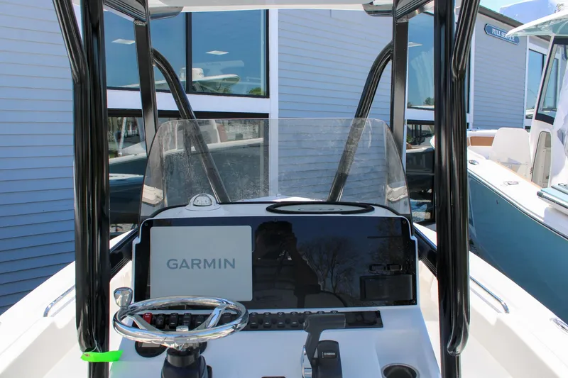 Slide: The Image of 2026 Sea Hunt Ultra 219 boat dashboard with Garmin navigation system. - 19