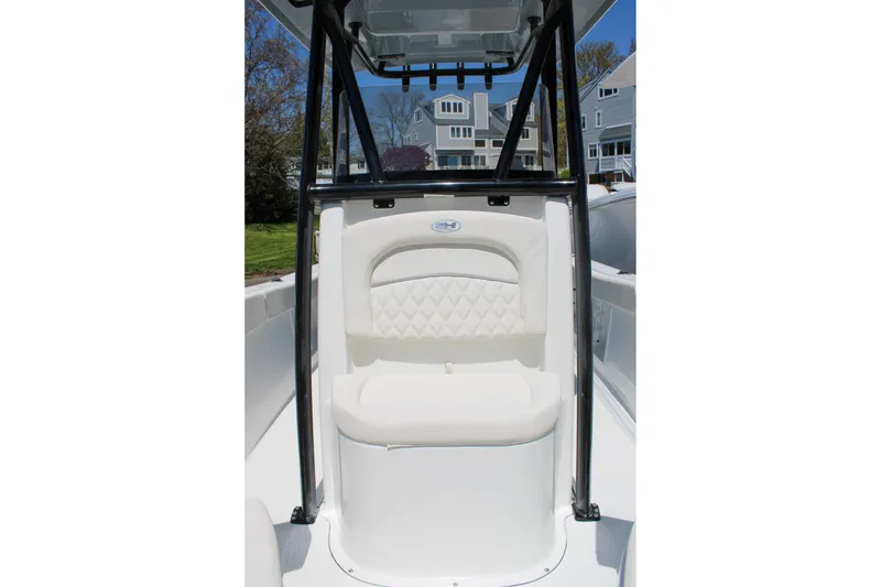 Slide: The Image of 2026 Sea Hunt Ultra 219 boat seat with white upholstery and black frame. - 21
