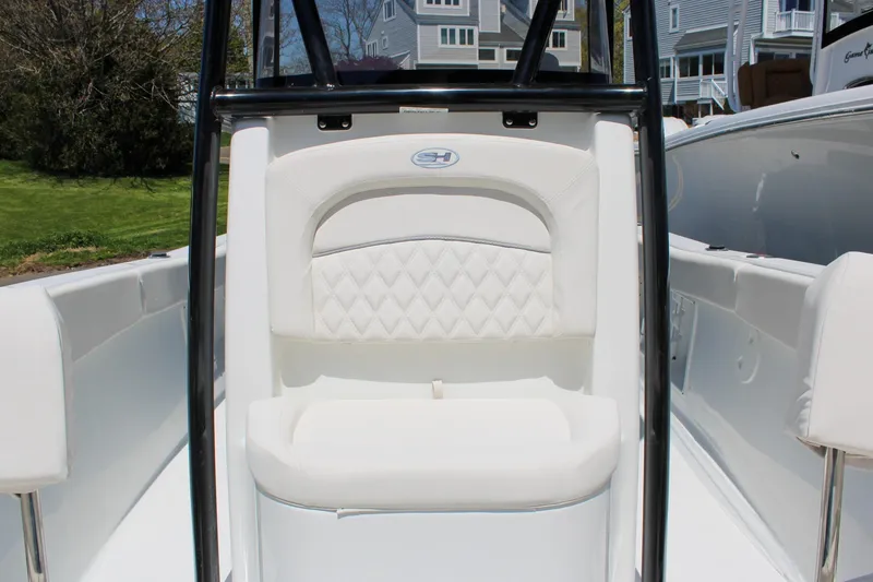 Slide: The Image of 2026 Sea Hunt Ultra 219 boat interior with white cushioned seating. - 4