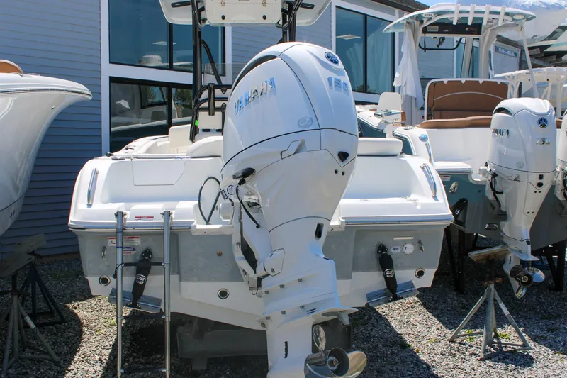 Slide: The Image of 2026 Sea Hunt Ultra 219 boat with Yamaha outboard motor, displayed outdoors. - 5