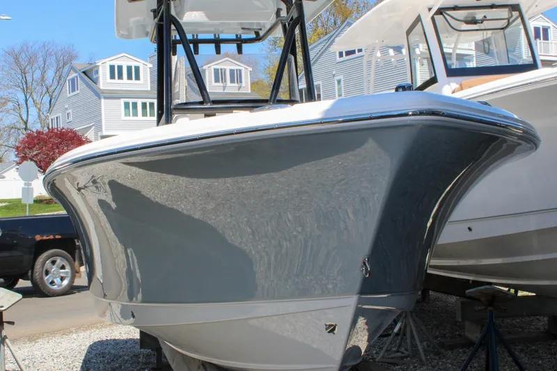Slide: The Image of 2026 Sea Hunt Ultra 219 boat displayed outdoors, showcasing sleek design and modern features. - 7