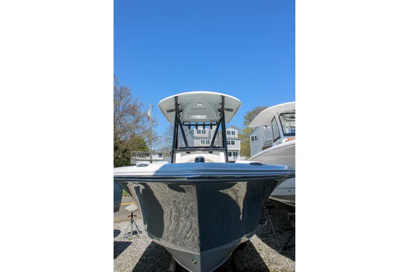 Slide: The Image of 2026 Sea Hunt Ultra 219 boat with sleek design under clear blue sky. - 9