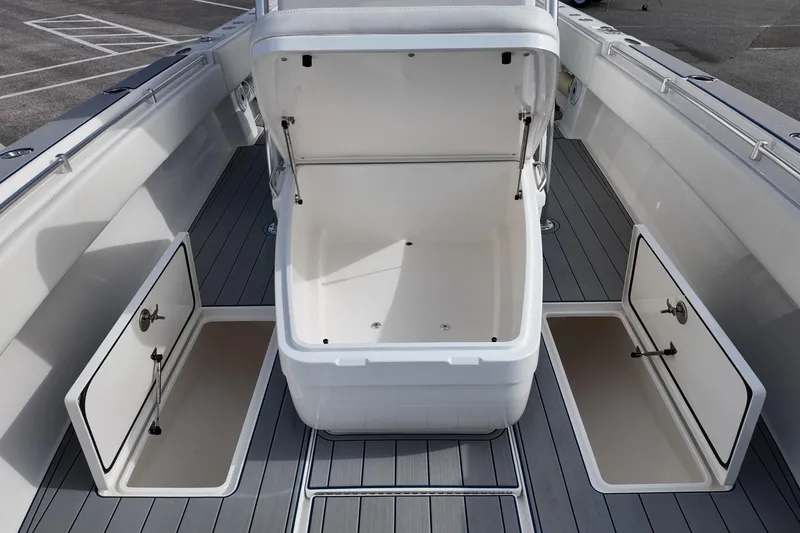 Slide: The Image of 2024 Contender 39 ST boat interior with open storage compartments and sleek design. - 12
