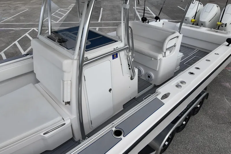 Slide: The Image of 2024 Contender 39 ST boat interior with seating and storage compartments. - 13
