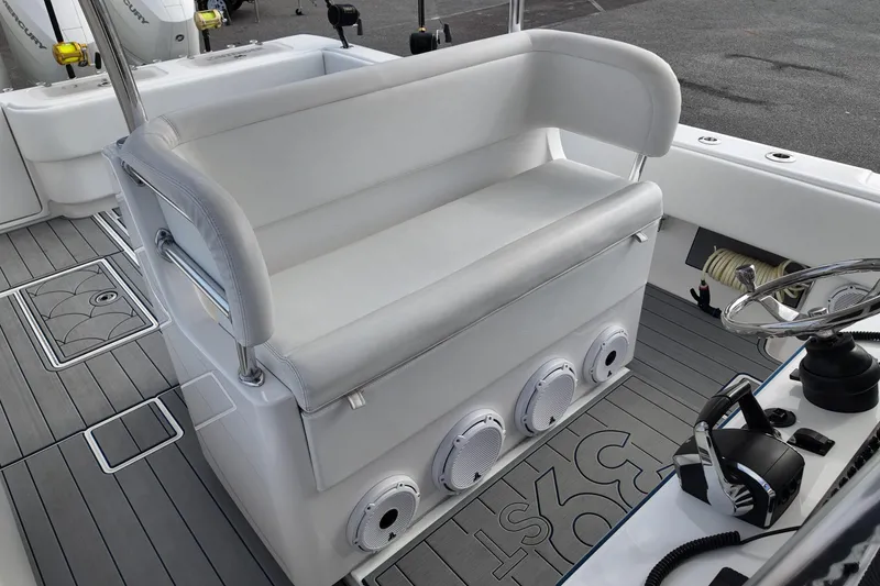 Slide: The Image of 2024 Contender 39 ST boat interior with white seating and modern controls. - 17