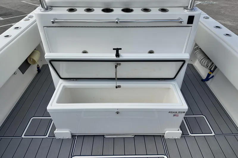 Slide: The Image of 2024 Contender 39 ST boat with open storage compartment on deck. - 21