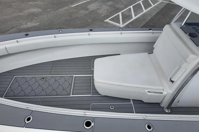 Slide: The Image of 2024 Contender 39 ST boat interior with sleek seating and modern deck design. - 24