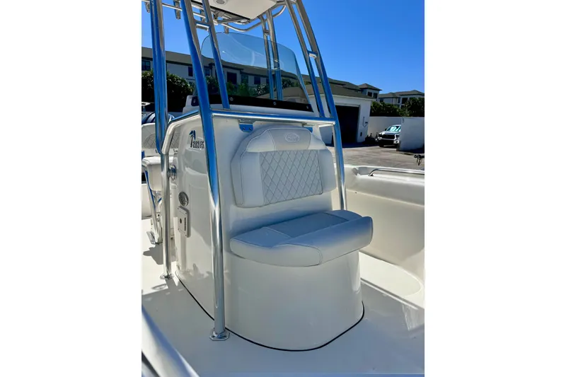 Slide: The Image of 2026 Key West 203 FS boat interior with cushioned seating and sleek design. - 15