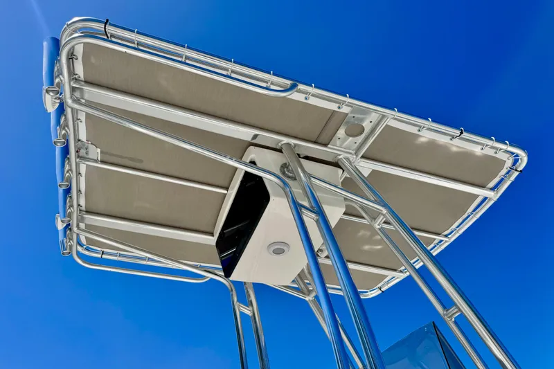 Slide: The Image of 2026 Key West 203 FS boat canopy against clear blue sky. - 16