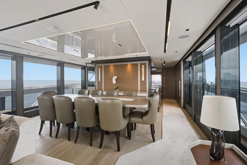 Slide: The Image of Luxurious dining area on 2024 Sunseeker 100 Yacht with ocean views and elegant decor. - 11