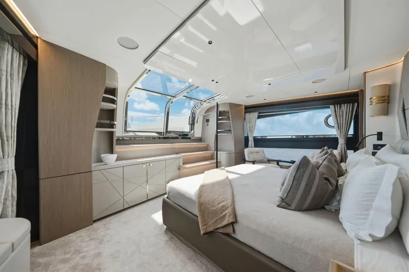 Slide: The Image of Luxurious interior of 2024 Sunseeker 100 Yacht with elegant bedroom and panoramic windows. - 16