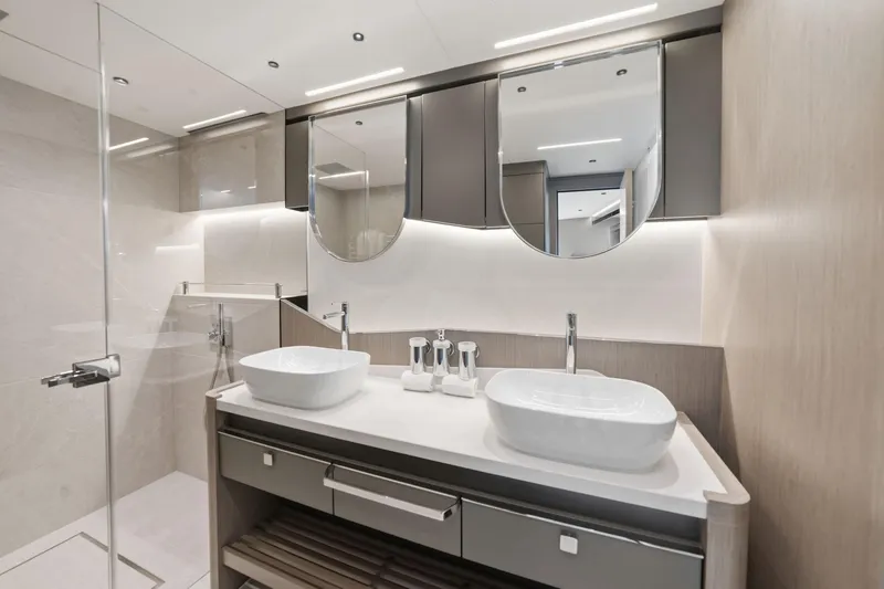 Slide: The Image of Luxurious bathroom in 2024 Sunseeker 100 Yacht with dual sinks and modern design. - 18