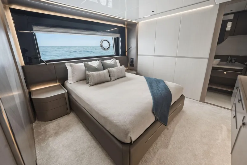 Slide: The Image of Luxurious bedroom interior of 2024 Sunseeker 100 Yacht with ocean view window. - 22