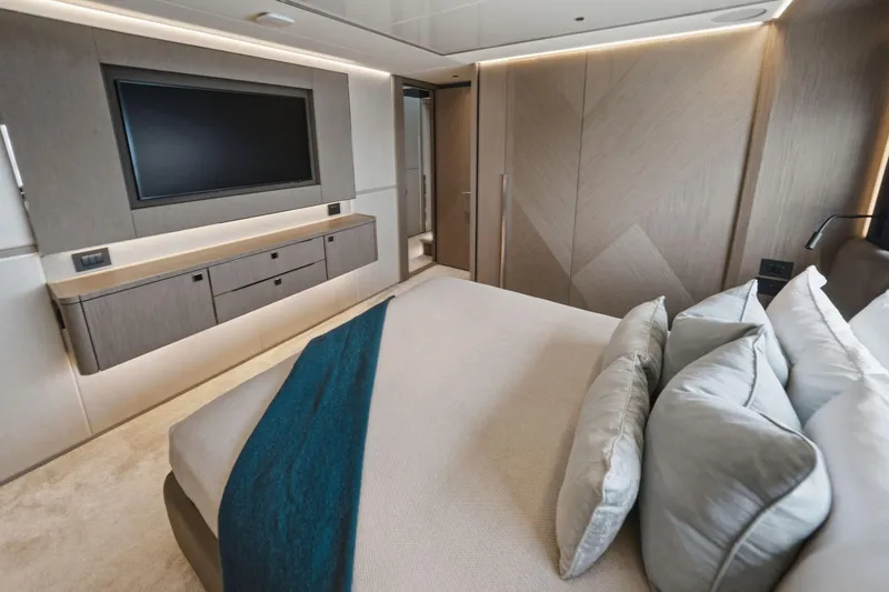 Slide: The Image of Luxurious bedroom interior of 2024 Sunseeker 100 Yacht with modern design and elegant furnishings. - 23