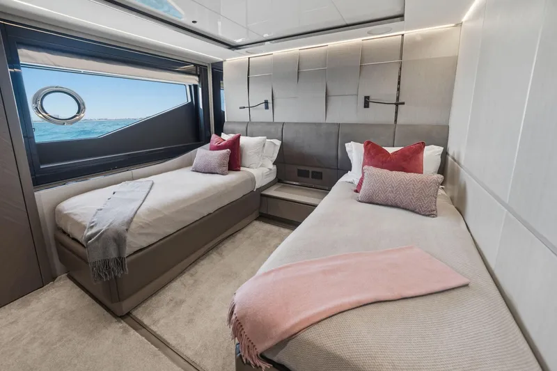 Slide: The Image of Luxurious twin bedroom on 2024 Sunseeker 100 Yacht with ocean view and elegant decor. - 24
