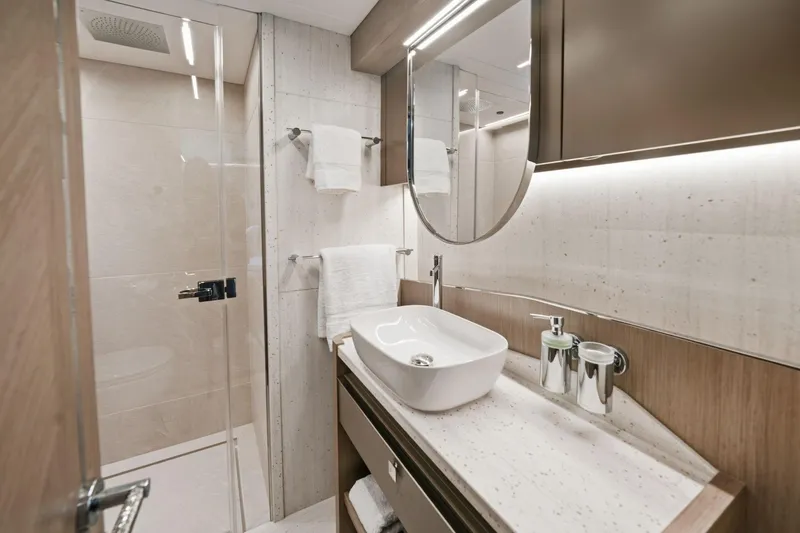 Slide: The Image of Luxurious bathroom in 2024 Sunseeker 100 Yacht with modern fixtures and elegant design. - 25