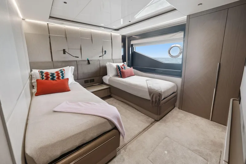 Slide: The Image of Luxurious twin bedroom on 2024 Sunseeker 100 Yacht with modern decor and ocean view. - 26