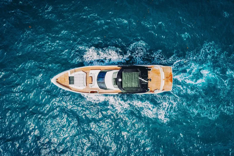 Slide: The Image of Aerial view of 2024 Sunseeker 100 Yacht cruising through vibrant blue ocean waters. - 27