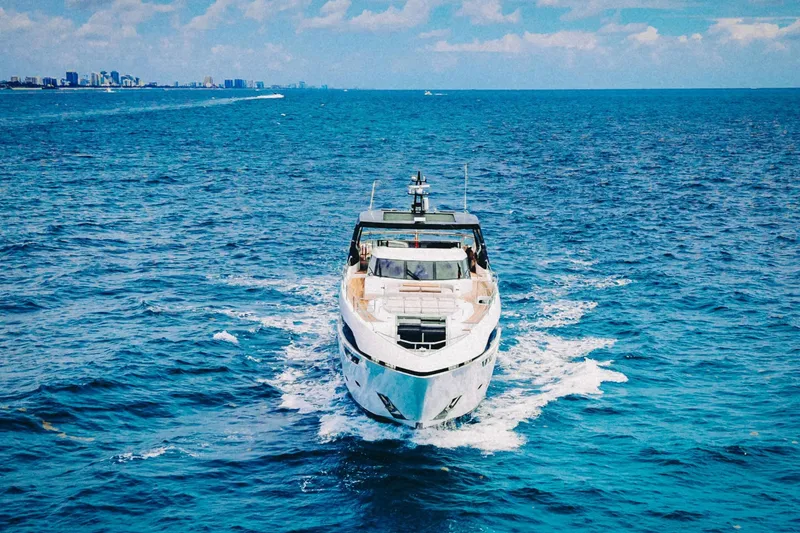 Slide: The Image of 2024 Sunseeker 100 Yacht cruising on open blue ocean waters. - 3