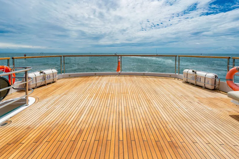 Slide: The Image of Spacious deck of 2024 Sunseeker 100 Yacht with ocean view and safety equipment. - 35