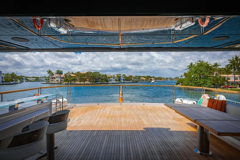 Slide: The Image of Luxurious 2024 Sunseeker 100 Yacht deck with scenic waterfront view. - 36