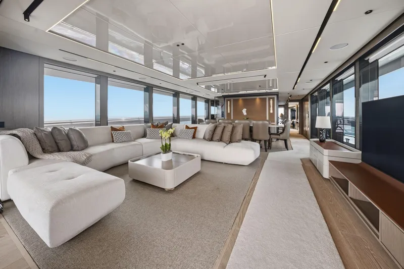 Slide: The Image of Luxurious interior of 2024 Sunseeker 100 Yacht with elegant seating and panoramic windows. - 8