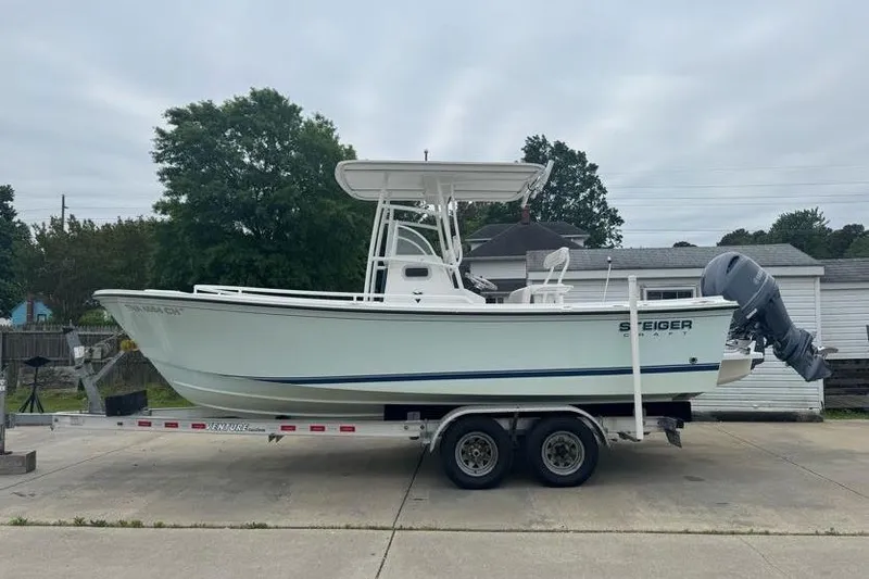 The Image of 2014 Steiger Craft 21 Tournament boat on trailer, parked outdoors. - 1