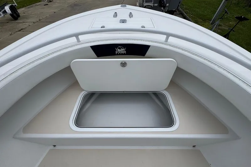 Slide: The Image of 2014 Steiger Craft 21 Tournament boat with open storage compartment on deck. - 12