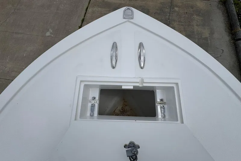 Slide: The Image of Bow view of a 2014 Steiger Craft 21 Tournament boat with open storage compartment. - 13