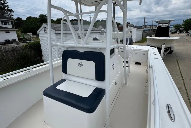 Slide: The Image of 2014 Steiger Craft 21 Tournament boat with seating and console, parked outdoors. - 15