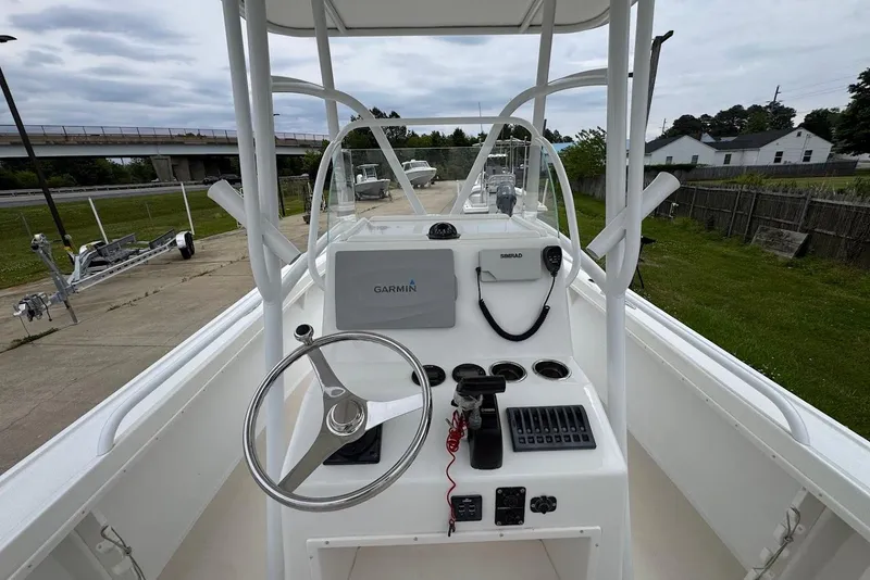Slide: The Image of 2014 Steiger Craft 21 Tournament boat dashboard with Garmin and Simrad equipment. - 8