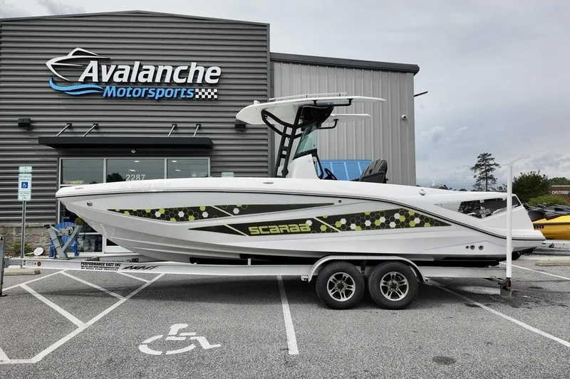 The Image of 2020 Scarab 255 ID boat on trailer at Avalanche Motorsports dealership. - 1