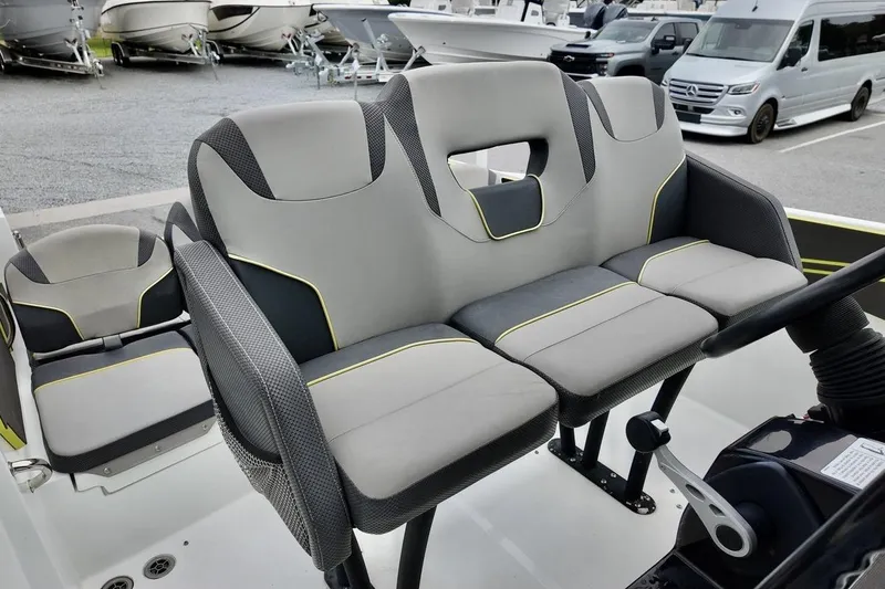 Slide: The Image of 2020 Scarab 255 ID boat interior with modern seating and steering wheel. - 10