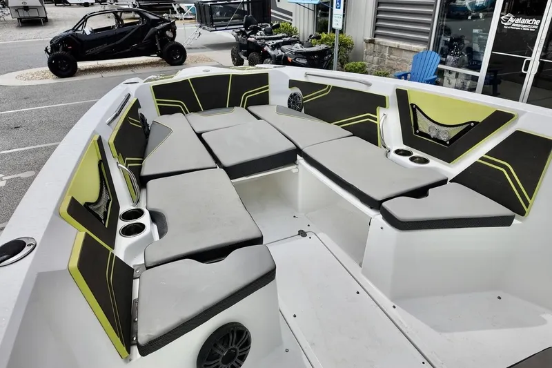 Slide: The Image of 2020 Scarab 255 ID boat interior with cushioned seating and cup holders. - 12