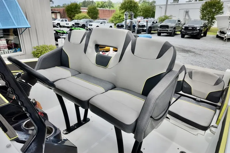 Slide: The Image of 2020 Scarab 255 ID boat interior with modern seating and steering wheel. - 15
