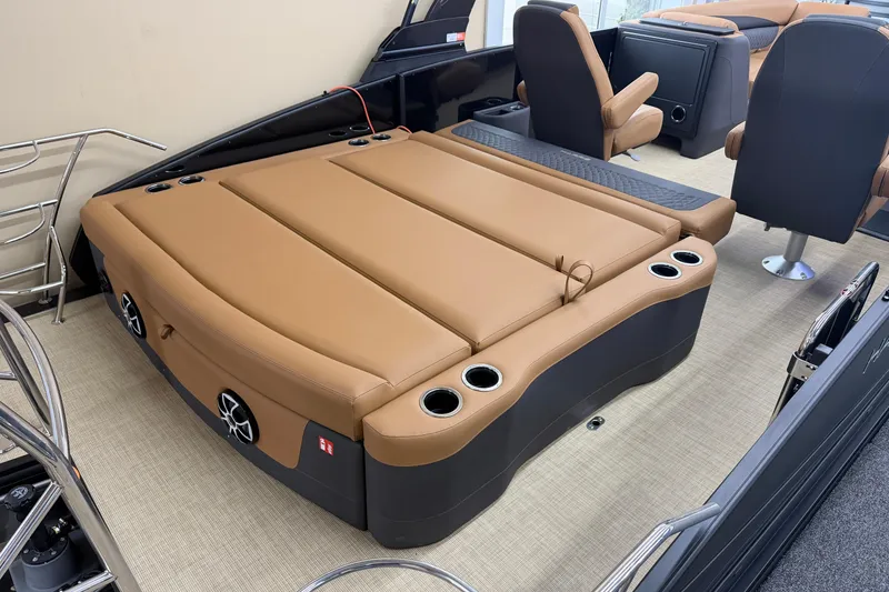 Slide: The Image of Luxurious interior of 2026 Harris Sunliner 230 pontoon boat with tan seating and cup holders. - 14
