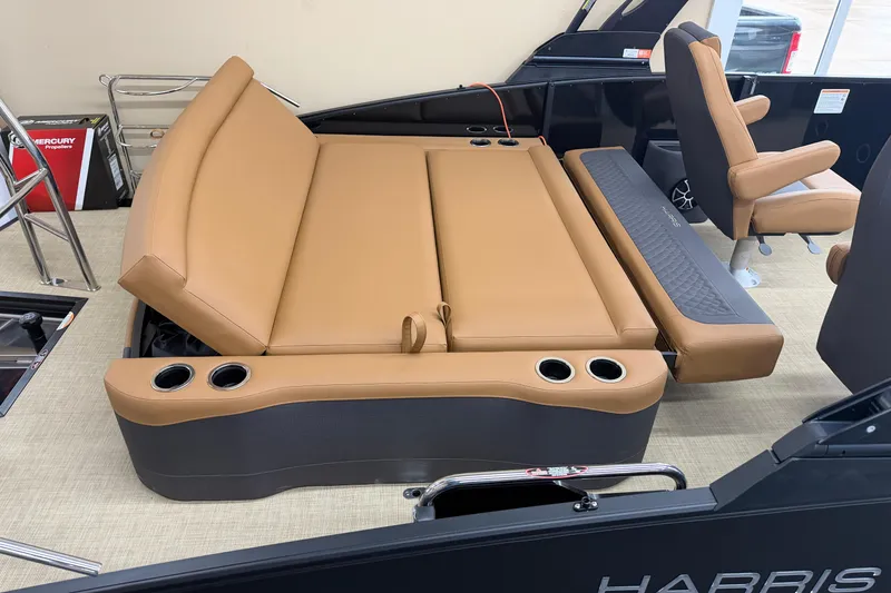 Slide: The Image of Luxurious seating on 2026 Harris Sunliner 230 boat with tan upholstery and cup holders. - 15