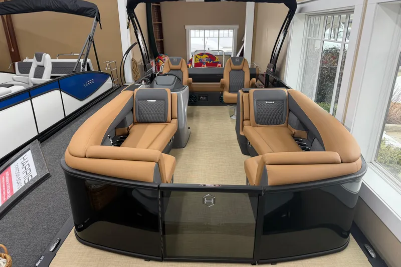 Slide: The Image of 2026 Harris Sunliner 230 pontoon boat with luxurious tan seating and modern design. - 2