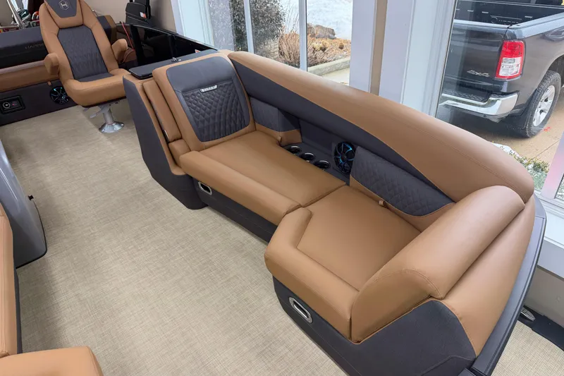 Slide: The Image of Luxurious interior of 2026 Harris Sunliner 230 pontoon boat with tan seating and modern design. - 3
