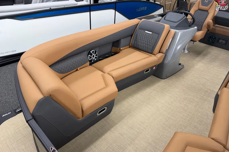 Slide: The Image of Luxurious interior of 2026 Harris Sunliner 230 pontoon boat with tan seating and modern design. - 4