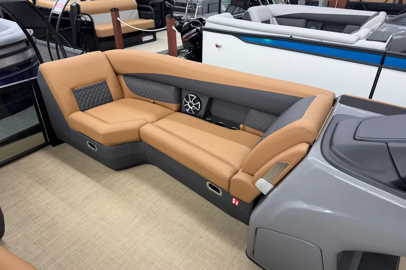 Slide: The Image of Luxurious seating on 2026 Harris Sunliner 230 pontoon boat with tan upholstery and modern design. - 5