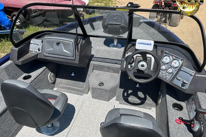 Slide: The Image of 2023 Tracker Pro Guide V-175 WT boat interior with steering console and seating. - 5