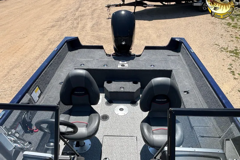 Slide: The Image of 2023 Tracker Pro Guide V-175 WT boat interior with seating and steering console. - 7