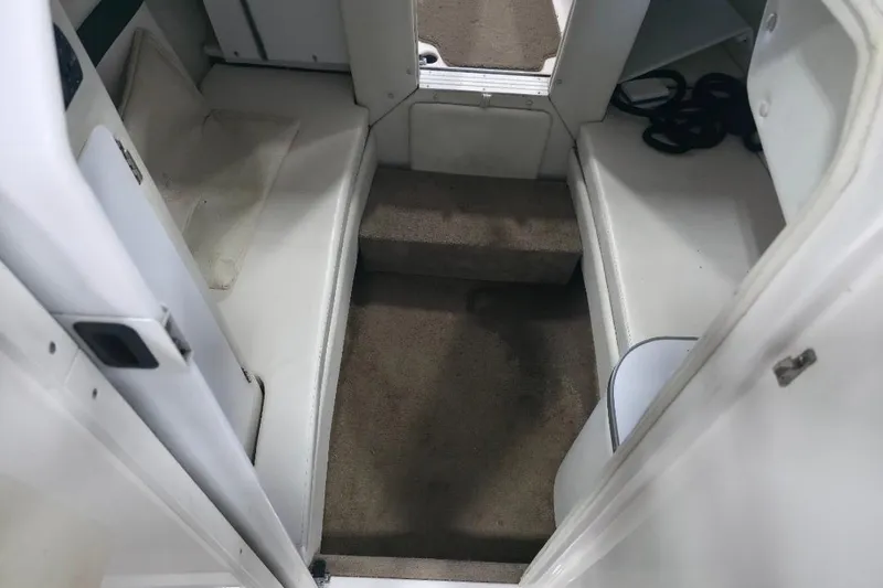 Slide: The Image of Interior view of a 2005 Envision 2900 Combo boat cabin with carpeted steps. - 12