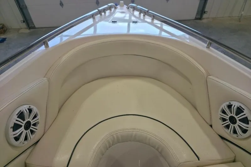 Slide: The Image of Interior view of 2005 Envision 2900 Combo boat with cushioned seating and speakers. - 15