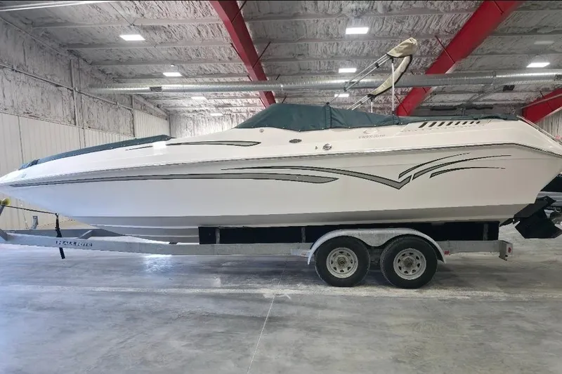 Slide: The Image of 2005 Envision 2900 Combo boat on trailer in indoor storage facility. - 3