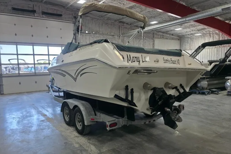 Slide: The Image of 2005 Envision 2900 Combo boat on trailer in indoor storage facility. - 4